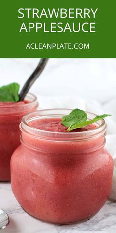 two mason jars filled with strawberry and basil smoothie