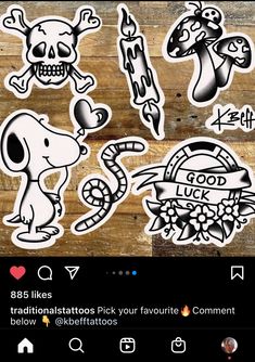 some stickers on a wooden surface with the words love and skulls in different languages