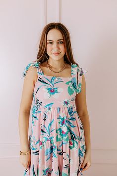 - Search for seashells in this adorable dress! - Lightweight material with a green, blue, and pink hued floral print - A built-in lining - A square cut neckline - 2-inch straps with tie closure - A bodice with a smocked back - Hidden side pockets - A flowy yet flattering silhouette that ends in a midi length hemline Catalina Island, Square Cut, Blue And Pink, Baby Pink, Midi Length, Cute Dresses, Sea Shells, Bodice, Floral Print