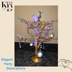 an elegant party decoration with purple flowers and pearls on the base is featured in this brochure