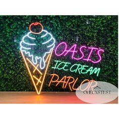 a neon sign that says oasis ice cream parq