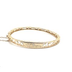 *Estate piece This darling children's bangle bracelet is a treasure to behold. Fashioned from 14 karat yellow gold, it exudes useful charm and resilience. Personalized with the name, "Allison" delicately engraved it becomes a cherished keepsake, symbolizing love and individuality. Adorning the "i" and "Allison" is a twinkling two point diamond, adding a touch of sparkle and whimsy. Perfect for little wrists this enchanting bracelet is an embodiment of innocence and joy destined to accompany its Heirloom 14k Gold Bangle For Anniversary, Heirloom 14k Stamped Bangle Gift, 14k Stamped Round Bangle For Gift, Classic 14k Stamped Bangle As Gift, Engraved Yellow Gold Bangle As Collectible, Yellow Gold Name Bangle For Wedding, Yellow Gold Wedding Name Bangle Bracelet, Collectible Yellow Gold Bangle Bracelet, 14k Gold Bangle Name Bracelet For Wedding