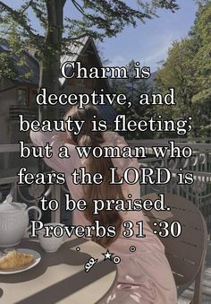 a woman sitting at a table in front of a tree with the words charm is decrepitive, and beauty is floating but a woman who fears the lord is to be praised prove