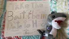 a stuffed shark is next to a sign that says take the boat to belem