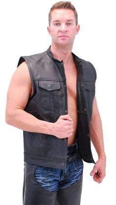 Motorcycle vest with dual concealed carry pockets, hidden front snaps, two chest pockets, two bottom pockets, stand up collar, two inside chest pockets and a soft nylon lining. This men's leather cut is just like your favorite jacket but without the sleeves! An S.O.A. sleeveless jacket style motorcycle cut with a one piece back that is ideal for club back patches. Also a great choice for a big leather vest! Big sizes available in this leather vest made of durable split cowhide leather. Sizes may run small. Sizes: 42, 44, 46, 48, 50, 52, 54, 56, 58. +$10 for 48-52, +$20 for 54-58. [5#] snap flap chest pockets pen hold in left chest pocket hidden snap up front 1 inch stand up collar two bottom pockets two inside cell phone pockets two inside concealed pockets soft nylon lining black color sp Biker Vest With Pockets, Sleeveless Biker Vest With Pockets, Motorcycle Vest, Leather Travel Bag, Leather Cuts, Stand Up Collar, Leather Hats, Leather Shirt, Sleeveless Jacket