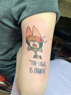 a person with a tattoo on their arm that says, the logic is erratic