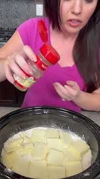 a woman is making food in the kitchen