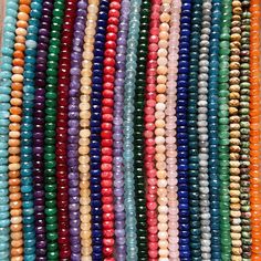 many different colored beads are arranged together