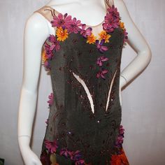 will fit size 7/8-11/12, very stretchy Experience the captivating style of this Brown Converta Ballroom Dress! Crafted from deep chocolate brown slinky and a nude color stretch illusion base, it's decorated with flowered chiffon panels in stunning hues of browns, oranges, yellows, greens, burgundies and purples for your Latin-rhythm dances. Embellished with elegant silk flowers and Swarovski-detailed rhinestones in amethyst, light burgundy, brown and orange, plus a sweeping orange full paneled s Fitted Brown Embellished Dress, Smooth Dance, Light Burgundy, Ballroom Dress, Silk Flower, Nude Color, Fall Flowers, Full Skirt, Ballroom