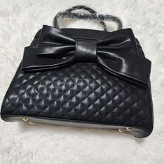 Quilted Hand Bag, Vintage Faux Leather Cross Body With Chain. Black With Bow. Purse Has Never Been Used. Black Faux Leather Shoulder Bag Fashion Accessory, Black Faux Leather Shoulder Bag, Black Faux Leather Shoulder Bag For Party, Vintage Black Quilted Shoulder Bag, Black Faux Leather Shoulder Bag With Gold-tone Hardware, Black Diamond-quilted Evening Bag, Black Faux Leather Bag With Silver-tone Hardware, Bow Purse, Vintage Black Bags With Gold-tone Hardware