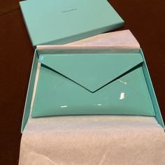 Brand New Wallet In Original Tiffany Box, Never Used. Patent Leather Tiffany Blue Envelope Wallet Bag With A Soft Beige Lining, And Snap Closure. Good For Holding Cash, Cards, Etc. Looks Bluer In Natural Light. The Color Of This Changes A Lot Depending On The Lighting But It Is True Tiffany Blue. I Would Say The First Photo Shows The Color Most Accurately But As You Can See In The Other Photos, It Really Depends On The Lighting. All Markings In The Photos Are The Result Of The Lighting Above, Th Blue Leather Wallet, Silver Wallet, Blue Envelope, Tiffany Box, Blue Envelopes, Jewelry Roll, Envelope Wallet, Black Leather Wallet, Soft Beige