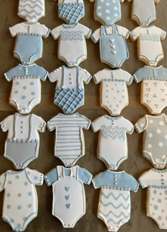 baby ones and onesuits decorated cookies on a table