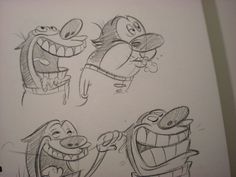 some cartoon characters are drawn in pencil on paper, and they appear to be laughing