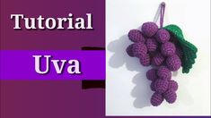 crocheted grapes hanging from a hook with the words verao canhoto written in spanish