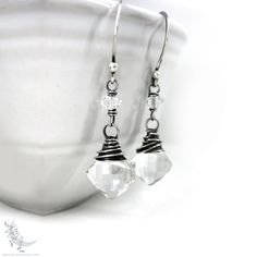 "Herkimer Diamond & Rock Crystal Quartz Sterling Silver Dangle Earrings * Genuine Rock Crystal Quartz and gemstones have been wire wrapped in sterling silver and dangle from handmade sterling silver ear wires. The sterling silver was oxidized to a deep charcoal finish, then brushed and polished to bring out the silver highlights. This creates a natural, organic finish with depth & shine. Herkimer Diamond are double-terminated crystal quartz from the Herkimer, NY mines. The focal quartz stones are crystal clear with very few inclusions; in addition, the gems are cut in a fantastic and unique 'cushion' diamond shaped cut. The quartz are finely faceted for excellent sparkle and light reflection. Truly unique and stunning little gems! Herkimer Diamond & Crystal Quartz are often used as an alte Nickel-free Crystal Earrings For Anniversary, Faceted Crystal Dangle Earrings For Gift, Adjustable Nickel-free Silver Crystal Earrings, Silver Crystal Jewelry With Ear Wire, Wire Wrapped Briolette Earrings For Anniversary, Silver Wire-wrapped Crystal Jewelry, Silver Wire Wrapped Crystal Jewelry, Silver Faceted Dangle Crystal Earrings, Nickel Free Briolette Earrings For Anniversary