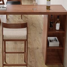 a wooden table with two chairs and a wine bottle on it next to a book shelf