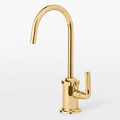 a gold faucet with the handle extended to it's side spout