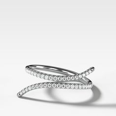 This negative space ring elegantly embraces the finger that wears it with full cut round diamonds in a traditional pave setting. 1.8 mm band 0.15 carats total Knife Edge Ring, Space Ring, Finger Cuff, Diamond Cuff Ring, Space Rings, Ring Stacks, Ring Wrap, Hammered Band, Cuff Ring