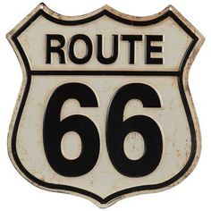 an old white route 66 sign with black numbers on it's side and the word route 66 below