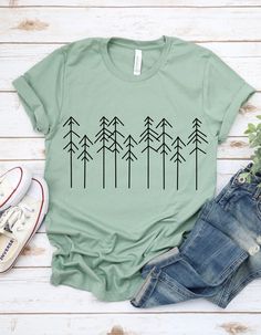 Pine Tree Sweatshirt, Hiking Tee Shirt, Funny camping shirt, Adventure shirt, Summer T shirt, Nature Shirt, Campers T-Shirt, Travel Shirt 🛍️ **HOW TO ORDER**   📄 Pick your size and color from the drop-down menus   📸 Review the sizing and color options in the listing photos   🛒 Add the item to your cart and complete the checkout process   🚀 We'll start working on your order right away!   ✏️ **SIZING**   📊 Please review the listing photos to see the size charts   🖼️ These photos will also s Green Crew Neck Top For Outdoor, Casual Green Tops For Outdoor Activities, Green Relaxed Fit Tops For Hiking, Green Short Sleeve T-shirt For Outdoor, Green Short Sleeve Tops For Outdoor, Black Short Sleeve Top For Camping, Green Cotton Top For Outdoor Activities, Green Cotton Tops For Outdoor Activities, Green Graphic Print T-shirt For Camping