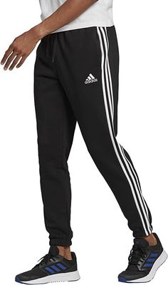 Adidas Men's Essential 3 Stripe Fleece Tapered Joggers. Sz. Med. Retail $45. Regular fit, not slim fit. Regular tapered fit Drawcord on elastic waist 53% cotton, 36% recycled polyester, 11% viscose fleece Side pockets Elastic cuffs Mid rise Imported Adidas Cotton Athleisure Joggers, Adidas Cotton Sportswear Joggers, Adidas Cotton Joggers Sportswear, Adidas Cotton Joggers For Jogging, Adidas Cotton Joggers With Three Stripes, Types Of Trousers, Popular Clothing, Tapered Joggers, Sophisticated Outfits