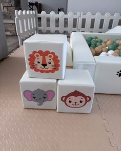 four cubes with animals painted on them