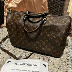 100% Authentic! See Picture For Authentication Sheet. Louis Vuitton Speedy 40 Bandouliere Customized Speedy 40 For Bandouliere Style. Size: 15.5/10/7.5” Shoulder/Crossbody Strap Has Been Added Vacheta Leather Has Been Dyed (Black) And Sealed For Long Wear. Handles Has Wear Signs And Inside Few Spots (See Pics). Canvas In Good Shape! It Has Been Cleaned And Conditioned! Please Note: The Bag Is Vintage, And In Overall In Good Clean Condition! From Smoke Free Clean House. Louis Vuitton Speedy 40, Speedy 40, Bags Louis Vuitton, Louis Vuitton Speedy, Crossbody Strap, Authentic Louis Vuitton, Clean House, Louis Vuitton Bag, Handles