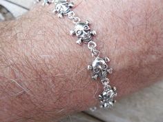 "Skull and crossbones bracelet....7.5\" long, cast in sterling silver, it has 11 skull and crossbones that are 3/8\" by 3/8\"..these skulls are solid ( see last photo), the bracelet weights 13.5 grams..." Silver Skull Print Bracelets As A Gift, Skull And Crossbones, Handmade Bracelets, Silver Bracelet, 925 Sterling Silver, Sterling Silver, Silver