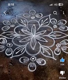 an image of a flower drawn on the ground with chalk paint and watercolors