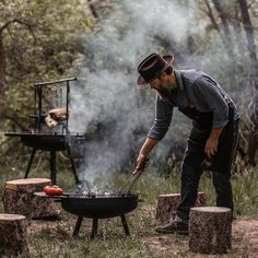 More compact than our Cowboy Fire Pit Grill - 30", this 23" version comes with a pole and grill grate for controlled temperature cooking. Enjoy as a fire pit or use to cook your next meal. This system works great for backyards or can easily be packed for camping. Shop the collection >> Cowboy Fire Pit, Cowboy Grill, Cookware Essentials, Open Fire Cooking, Outdoor Bbq Grill, Grilling Sides, Fire Grill, Fire Pit Grill, Camping Cookware