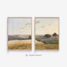 two paintings on the wall, one with grass and trees