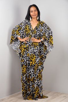 "Black Boho Kaftan Dress Oversized Women's Frock Maxi Dress Long loose fit dress with floral print Funky Elegant Collection --> Produced by NUICHAN & Co PRODUCT SIZE : One Size Fits Most * Chest : free up to 32 - 58\" * Waist : free up to 58\" * Hips : free up to 56\" * Length : 58\" from shoulder to hem, measured laying flat - when hanging it measures up to 60\" ) * Sleeve length : 24\" MATERIAL * ITY Polyester MODEL : * Model chest : 32\", waist : 24\" hips : 35\" * Combined Height is 5\"6 > I Black Printed V-neck Kaftan, Yellow Printed V-neck Kaftan, Flowy Printed V-neck Tunic, Multicolor Oversized V-neck Dress, Oversized Multicolor V-neck Dress, Casual Yellow V-neck Kaftan, Printed V-neck Free Size Kaftan, Oversized V-neck Beach Cover-up Dress, Oversized V-neck Dress For Beach Cover-up