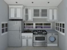 an empty kitchen with white cabinets and silver appliances