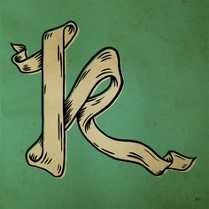 the letter k is made up of wood and has been drawn with ink on it