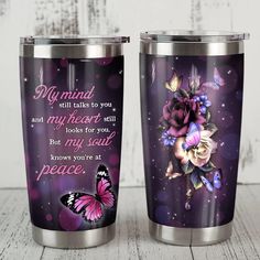 two stainless steel tumblers with purple flowers and butterflies on them, one has a poem written