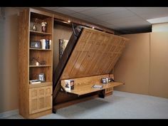 an open wooden book case in the shape of a large, triangular piece of furniture