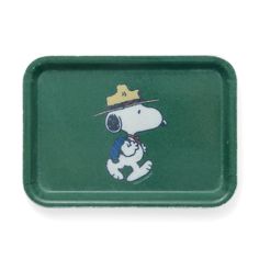 a green tray with a cartoon dog wearing a hat