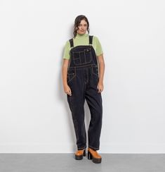 Vintage 90's black denim overalls. Denim dreams really do come true! Classic jean overalls. Medium/light weight soft denim. Contrasting yellow stitching. In great condition with almost no signs of wear. Well laundered and ready to wear. Colors may vary from screen to screen. Over-dyed black by us.  Material: Denim (100% Cotton) Best Fit: Extra Large Size On Tag: 20 Brand: St John's Bay / Made In Hong Kong Sizing Bust: Open Shoulder To Bottom:  59.5" (Adjustable) Hips (Double / Measured Flat):   24" Middle Band (Double / Measured Flat):   21.5" Inseam:  29" Thigh (Double / Measured Flat):  15.5" Ankle (Measured Flat / Double):  9.25" For reference the model measures: Height 5'9" / Waist  33" / Hips  43" /  Overalls fit the model as shown, not pinned on model. Measured with overalls lying fl Black Relaxed Fit Overalls With Pockets, Black Relaxed Fit Overalls For Work, Black Overalls With Bib Front And Pockets, Black Overalls With Pockets For Streetwear, Black Utility Overalls With Bib Front, Black Bib Front Utility Overalls, Black Utility Denim Jumpsuit For Fall, Black Relaxed Fit Denim Overalls, Black Denim Overalls For Fall