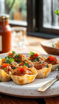 small cups filled with food sitting on top of a white plate