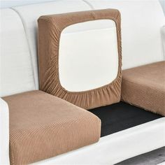 a close up of a couch cushion with a square shaped pillow on top of it