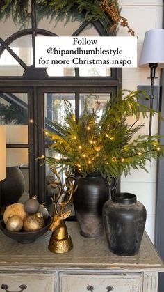 a christmas display with pine cones and other holiday decorations