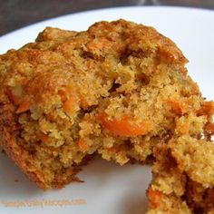 two pieces of carrot muffin on a white plate