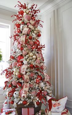 a christmas tree decorated with red and white ornaments