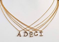 Gold Plated Tiny Pave Initial Letter Necklace, Personalized Pendant, Dainty, Bridesmaid, Wedding Minimalist Bridal Party Gift, Upper Case This beautiful minimalist necklace features a gold plated initial, encrusted with CZ crystals. Dangling from a delicate cable link chain, it's just the piece to bring an extra-special touch to your favorite outfits. It makes a heartfelt gift for your bff, your bridesmaids, or any special person in your life. Details: Materials: gold plated brass and Cubic Zirc Elegant Wedding Name Necklace With Delicate Chain, Minimalist Initial Pendant Necklace For Wedding, Elegant Adjustable Name Necklace With Delicate Chain, Elegant Name Necklace With Delicate Adjustable Chain, Minimalist Pendant Initial Necklace For Wedding, Elegant Initial Necklace With Delicate Chain For Wedding, Elegant Silver Initial Necklace For Bridesmaid Gift, Minimalist Wedding Pendant Initial Necklace, Elegant Wedding Name Necklace With Adjustable Chain