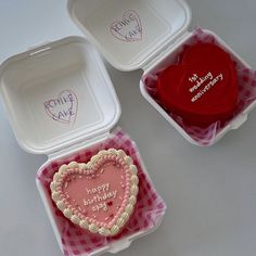 three valentine's day heart shaped cakes in plastic containers with happy birthday messages on them