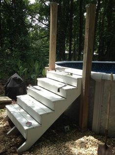 a set of stairs leading up to an above ground pool