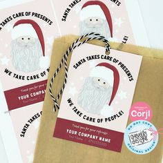 three christmas gift tags with santa's face on them