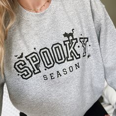 Spooky season is upon us!  Heather gray sweatshirt with black writing Runs slightly larger / if you want an oversized feel, keep your regular size. 50% cotton, 50% polyester Adult Unisex sizing Concealed seam on cuffs Seamless body Double-needle coverseaming on neck, armholes and waistband 1x1 ribbed collar, cuffs and waistband with spandex Recommended Care Instructions Machine wash delicate cycle, cold/warm, inside out with like colors. Remove immediately after washing. Tumble dry on low or hang dry. Do not iron decal. Do not dry clean. Halloween Letter Print Sweatshirt For Streetwear, Halloween Streetwear Sweatshirt With Letter Print, Gray Slogan Sweatshirt For Fall, Oversized Halloween Sweatshirt For Loungewear, Spooky Fall Sweatshirt For Streetwear, Spooky Letter Print Sweatshirt For Winter, Spooky Style Fall Sweatshirt For Streetwear, Spooky Crew Neck Sweatshirt For Fall, Oversized Spooky Sweatshirt For Fall