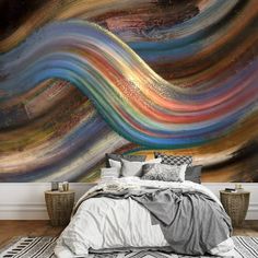 an artistic wall mural in a bedroom with a bed and rugs on the floor