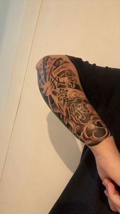 a man with a tattoo on his arm